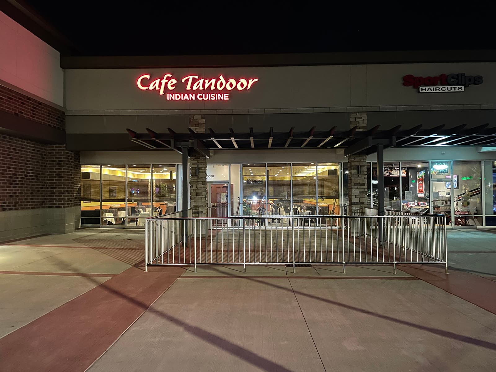 The Cafe Tandoor storefront at night